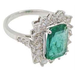 18ct white gold emerald and round brilliant cut diamond cluster ring, with diamond set shoulders stamped 18K, emerald approx 2.55 carat, total diamond weight approx 1.40 carat