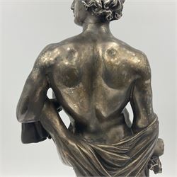20th century silver plated figure, modelled as a classical male figure, possibly Prometheus, holding flames, one foot resting atop a small dragon, upon a circular spreading base, overall H37.5cm