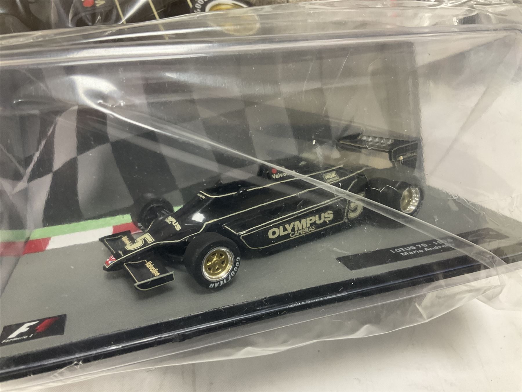 Panini Formula 1 The Car Collection - twelve die-cast models including ten in unopened packaging with periodical; all models in plastic display boxes; and eight other boxed die-cast models of racing cars by Corgi, Onyx, Classico, Minichamps etc (20)