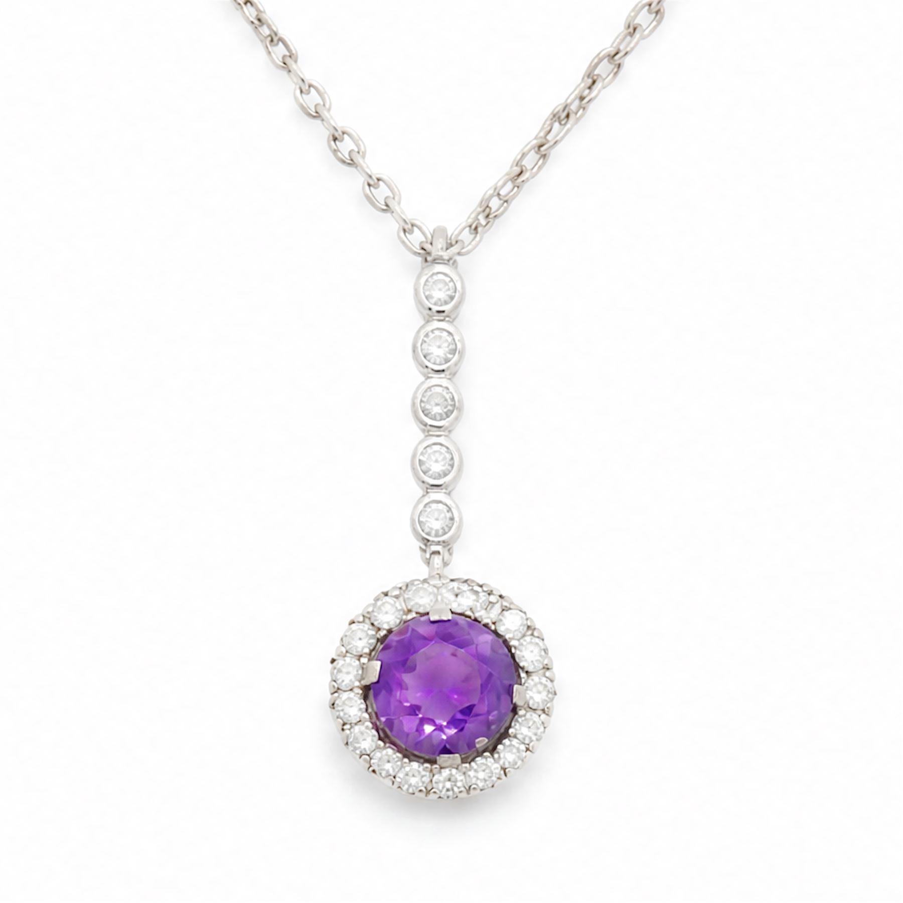 Early 20th century white gold silver amethyst and diamond pendant, round cut amethyst, surrounded by seventeen old cut diamonds, suspending from a five stone diamond set bail, to a silver chain necklace, total diamond weight approx 0.40 carat