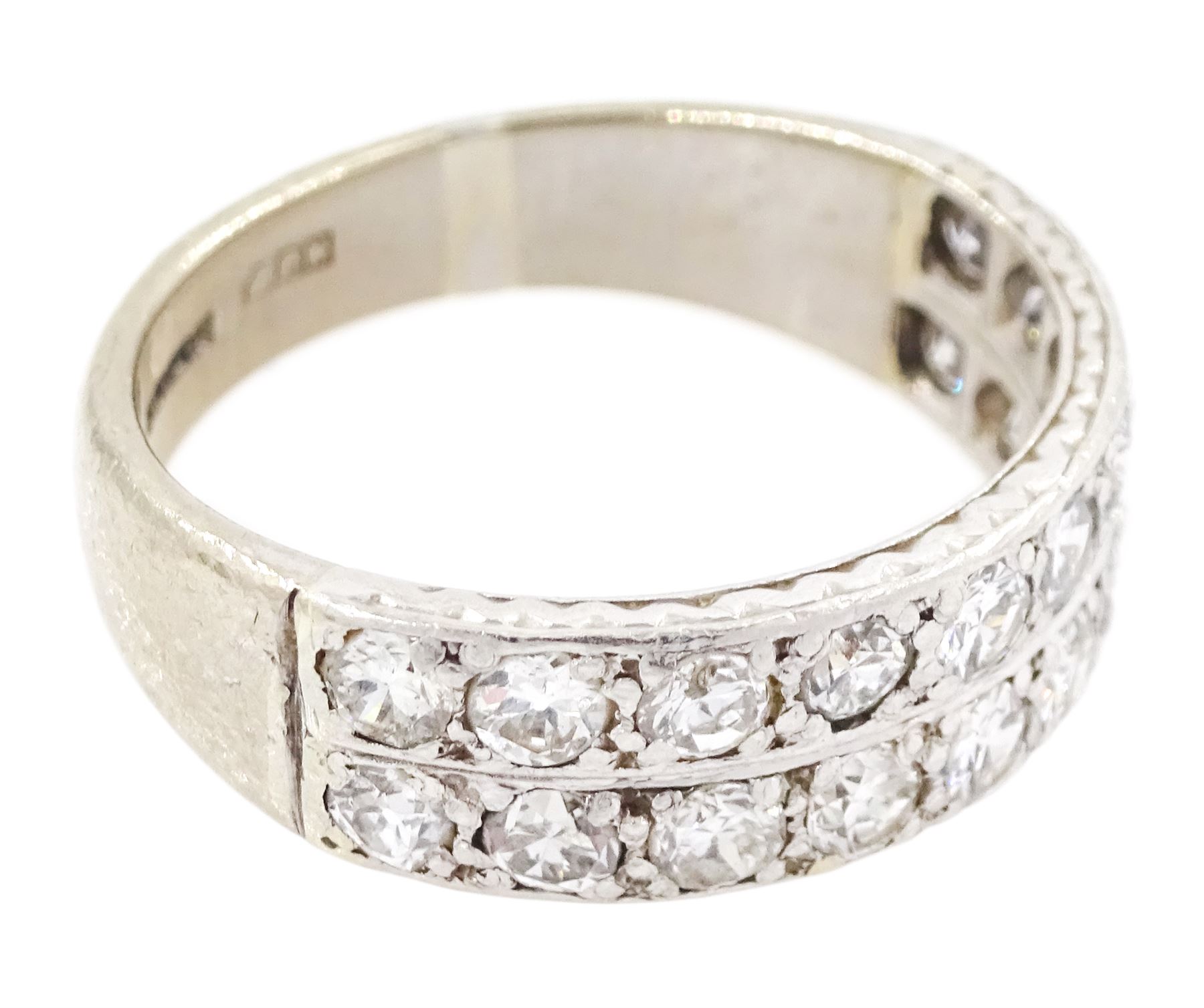 18ct white gold and platinum diamond half eternity ring, two rows each set with ten old cut diamonds, the sides with engraved decoration, Birmingham 1985, total diamond weight approx 1.20 carat