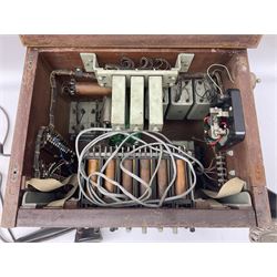 Early-mid 20th century internal telephone system, comprising exchange box with attached TMC rotary telephone and dictograph with Bakelite handset and support upon stained wood case, and 1960s black Bakelite telephone model 312L with G.P.O sticker beneath, largest H30.5cm W36.5cm D30cm