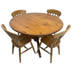 Waxed pine circular pedestal dining table (D122cm, H77cm), and a set of four beech farmhouse design dining chairs