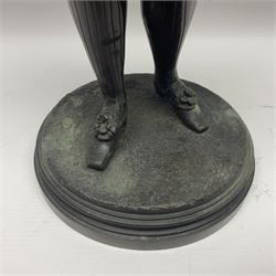 Bronzed figure, modelled as man in tradition 16th century dress, upon a circular base, H47cm 