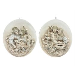 Pair oval continental plaques, decorated in relief with two figures, H20cm 