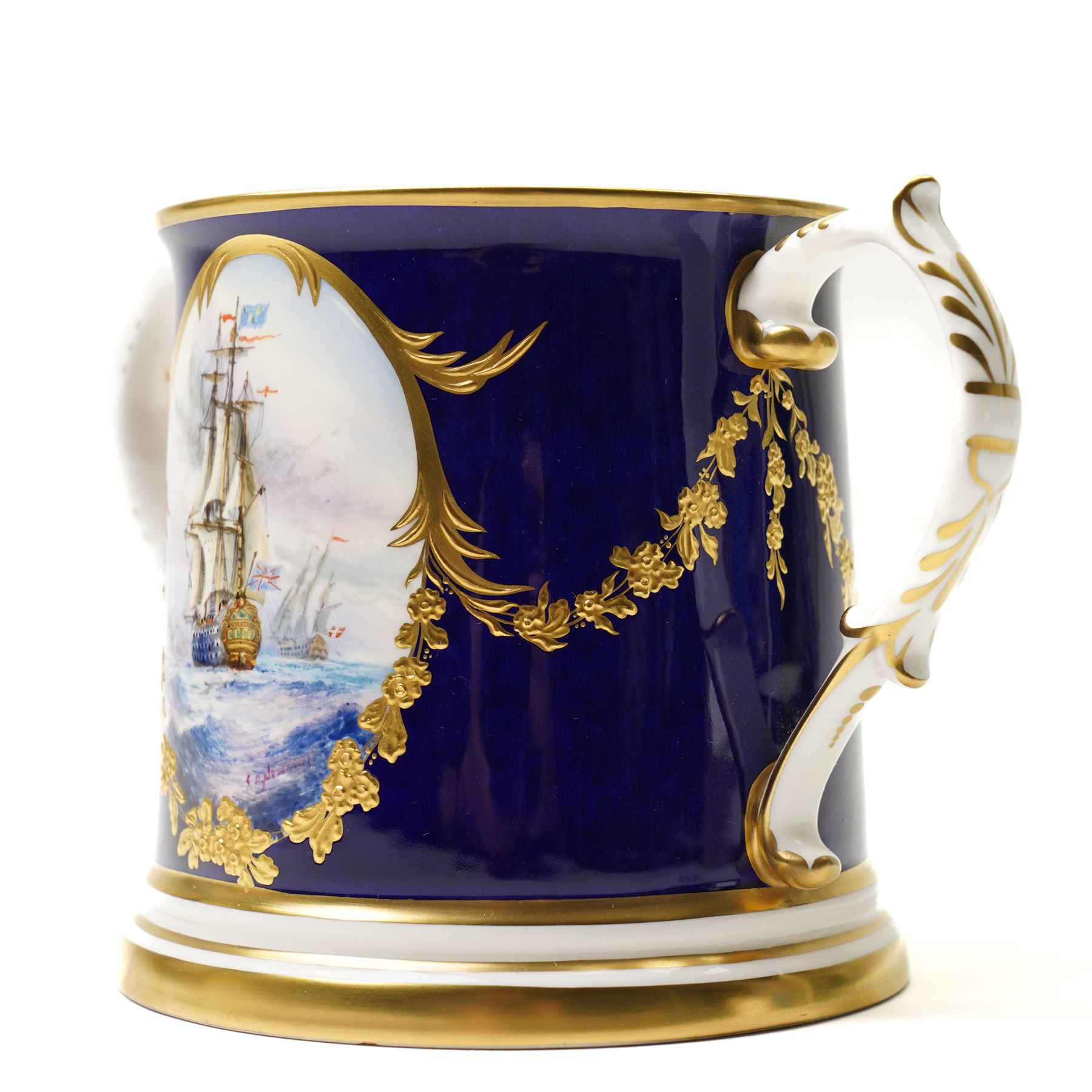 Lynton Porcelain Company loving cup, decorated with a British naval frigate, signed Stefan Nowacki, on a cobalt blue ground finely embellished in gilt enamel, printed marks to base, H11.5cm 