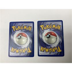 Collection of Pokemon trading cards, mostly 1999 Wizards Pokemon cards to include holo Charizard 4/102, first edition holo Machamp 8/102, further holographic cards; Dark Flareon 35/82 and Dark Vaporeon 45/82, cards from themed sets and 4th edition prints; 1998 Electronic Pokédex with cardboard boxes for themed decks Blackout, Overgrowth and Power Reserve Jungle, along with a large quantity of energy and trainer cards 