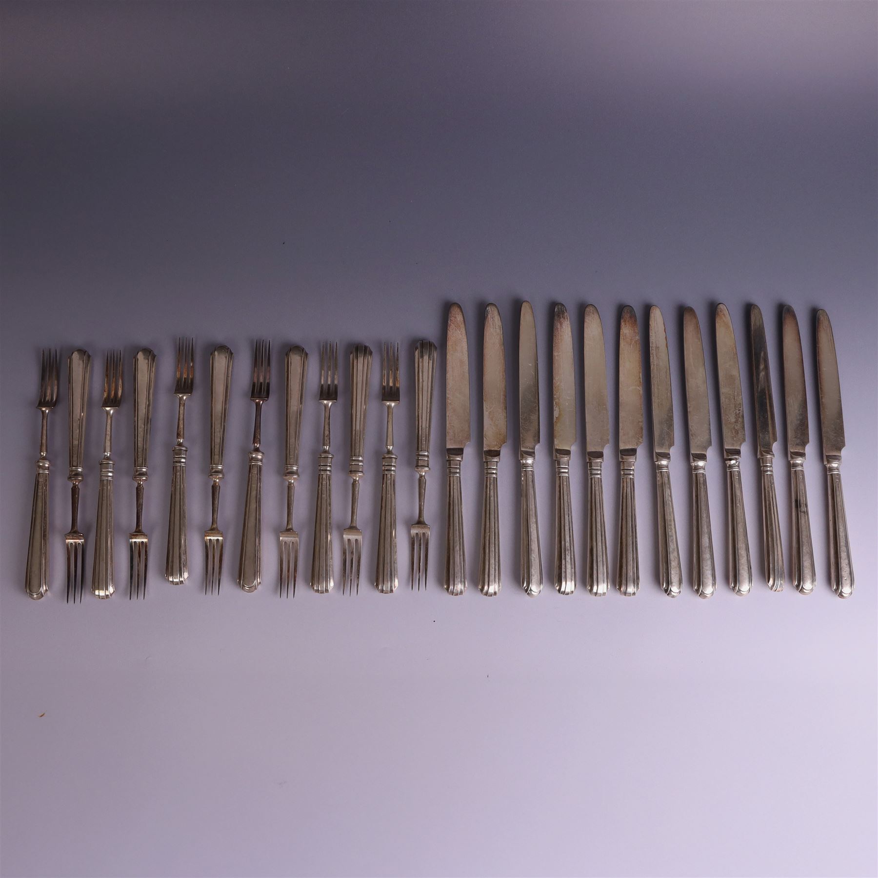 Set of twelve 1920s silver handled dessert knives and forks, hallmarked Thomas Bradbury & Sons Ltd, Sheffield 1921