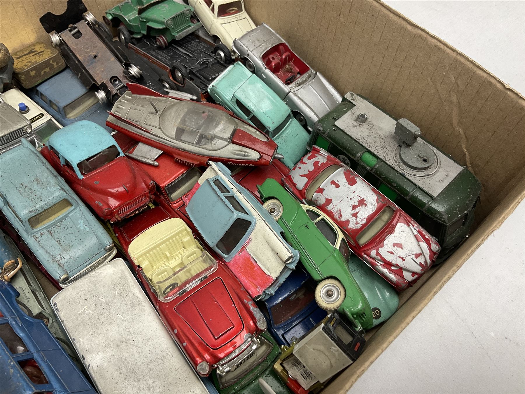 Dinky - over thirty unboxed and playworn die-cast models including Vega Major Luxury Coach, Peugeot 404, Humber Hawk, Ford Transit Van, Jaguar Type D etc; fourteen Dinky road signs; and quantity of other models including Budgie Supercar, Tri-ang Spot-On, Tekno etc