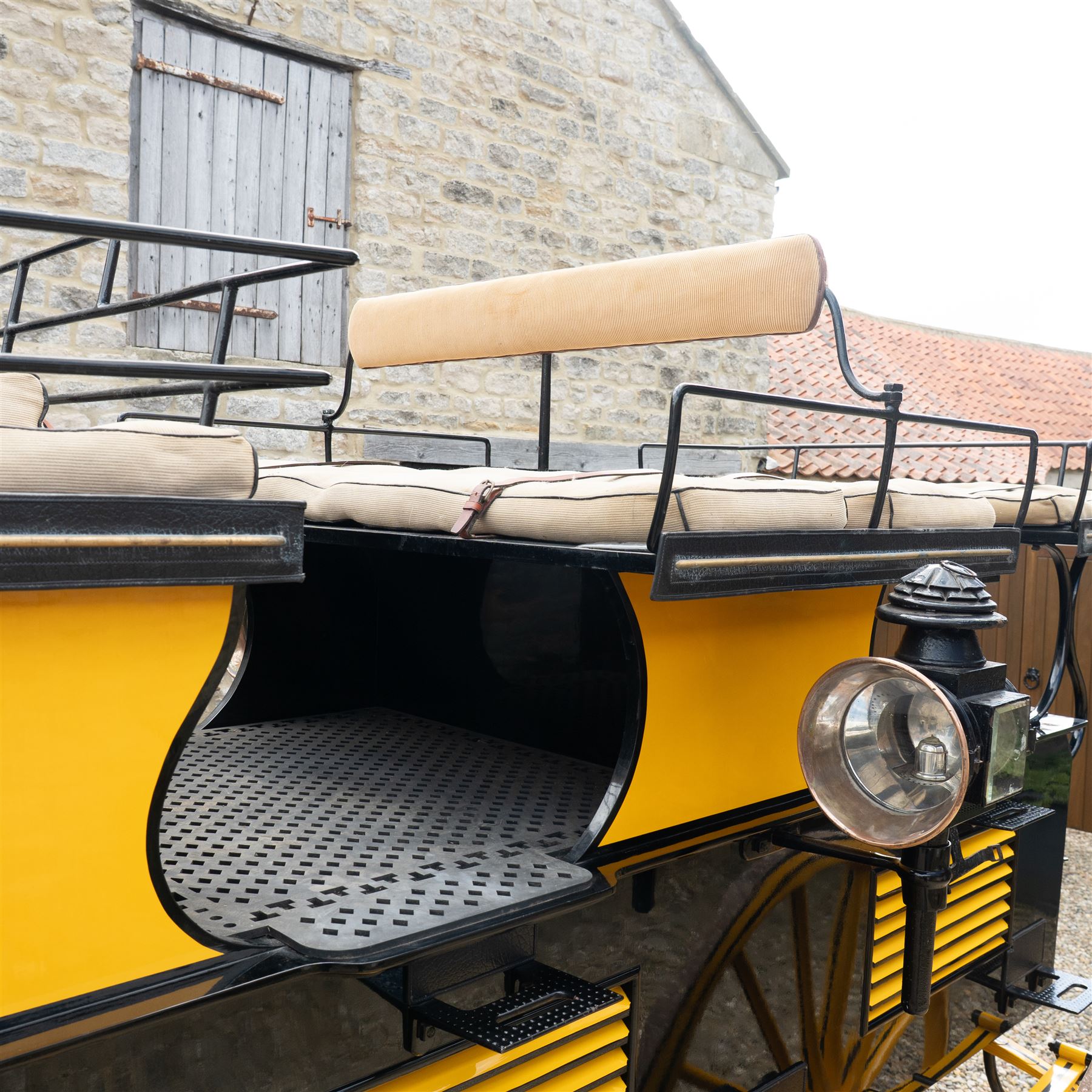 Roof Seat Break by Shanks of London

A roof seat break by Shanks of London built on a perch in black and yellow livery, the body fitted with an elevated driver's box seat, elevated rear groom's seat and central passenger compartment. The carriage is mounted on wooden spoked wheels with leaf spring suspension and is equipped with louvred underbody storage compartments, carriage lamp brackets (lamps next lot), folding access steps and a pole for driving with a pair or team of horses. The wheel hubs are stamped 