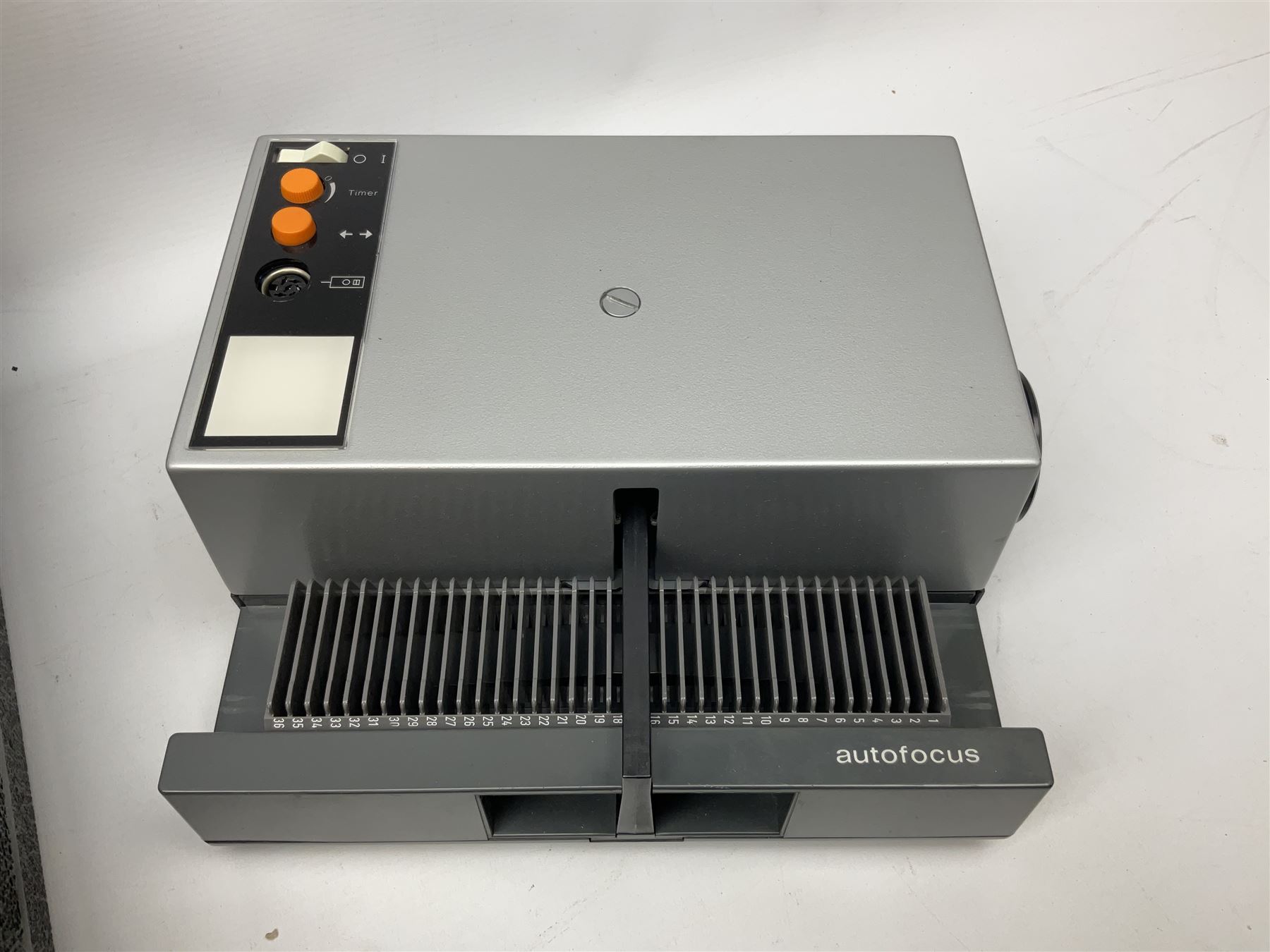 Cased Rollei projector together with a palar projector screen, autofocus slide projector and cenei scoper 360 