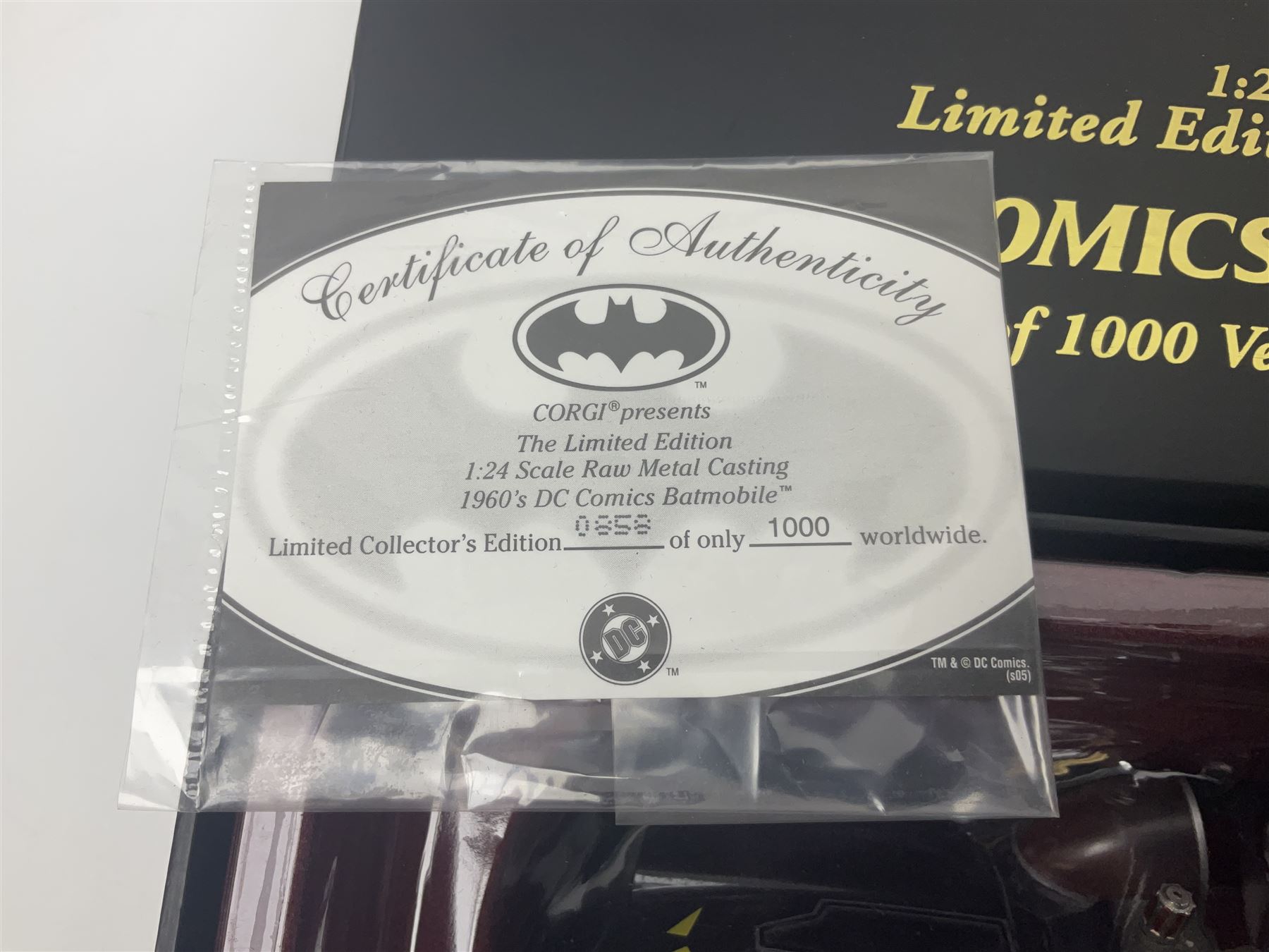 Two Corgi DC Comics die-cast Batmobiles comprising 1:18 scale die-cast Limited Edition Pre-Production Raw Metal Casting 1940 Batmobile Roadster no. 184/300, and 1:24 scale die-cast Limited Edition Raw Metal Casting 1960 Batmobile no. 858/1000, both with original boxes and certificates of authenticity 