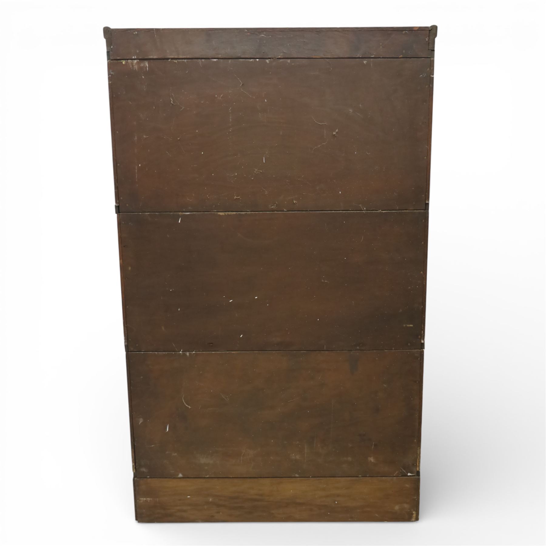 Globe Wernicke - early 20th century three sectional stacking library bookcase, two glazed sections above a panelled section, on a plinth base with inbuilt drawer