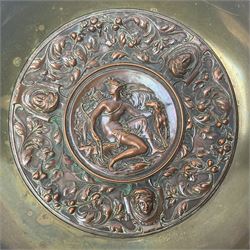 19th century French brass pedestal bowl, the circular bowl inset to centre with embossed copper plaque depicting the Goddess Diana with dog and bow, surrounded by a border of putti masks, leaves and berries, upon brass stem and foot, the stem with copper knop, embossed with three portraits of Diana, stamped C.Het. Co Depose beneath, H15.5cm