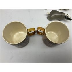 1970's Hornsea mugs, comprising Train Robber pattern designed by John Clappison and Owl from the ‘Newsprint’ Zoo range designed by Jack Dadd, and three USSR figures of animals comprising raccoon, ferret and badger