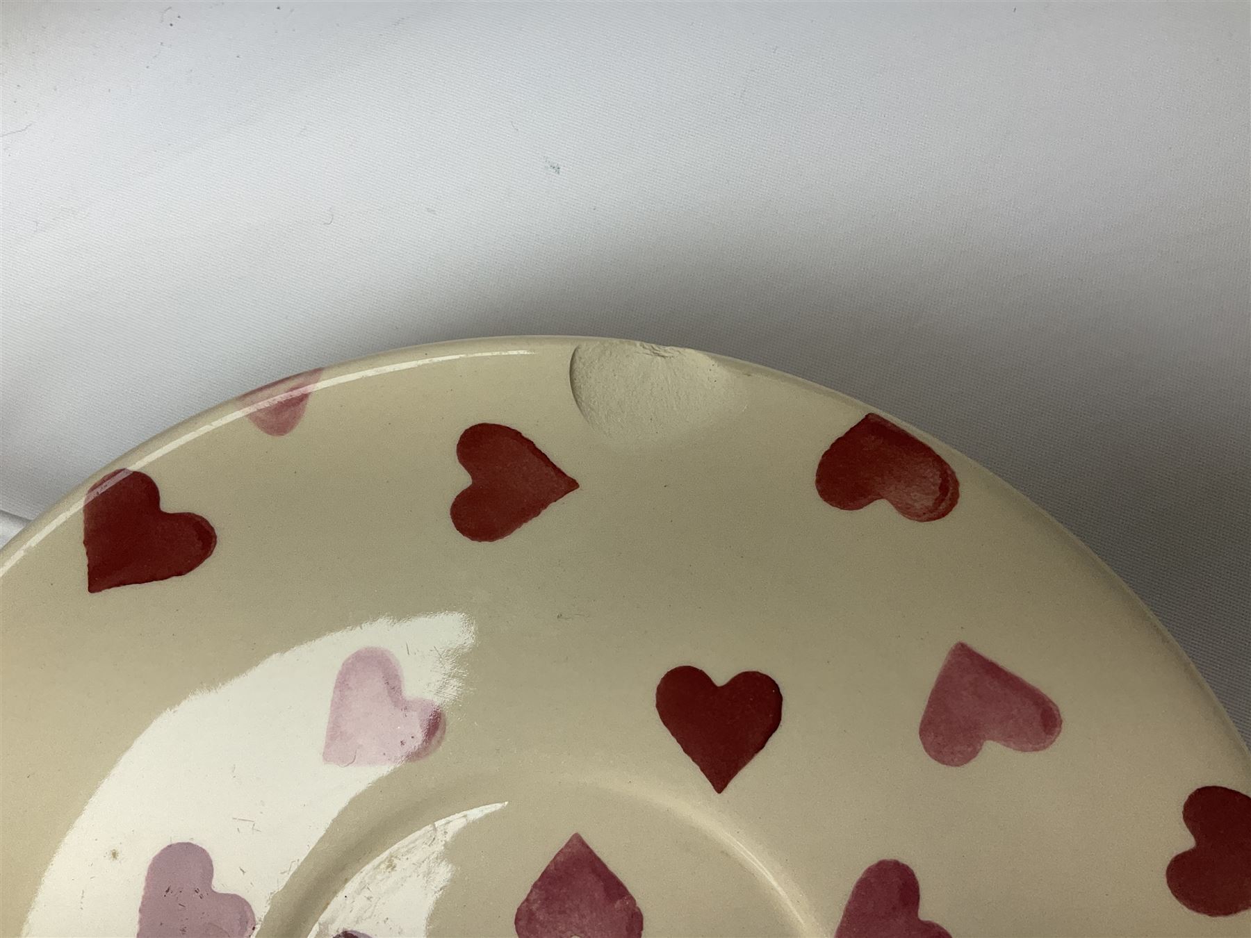 Collection of Emma Bridgewater spongeware ceramics, to include Pink Hearts pattern teapot, milk bottle vase, teacup and saucers, Love & Kisses sugar shaker and large 'I love you more than Marlon Brando' mug, British Birds and Black and White pattern mugs, etc, all with printed marks beneath, tallest H21.5cm