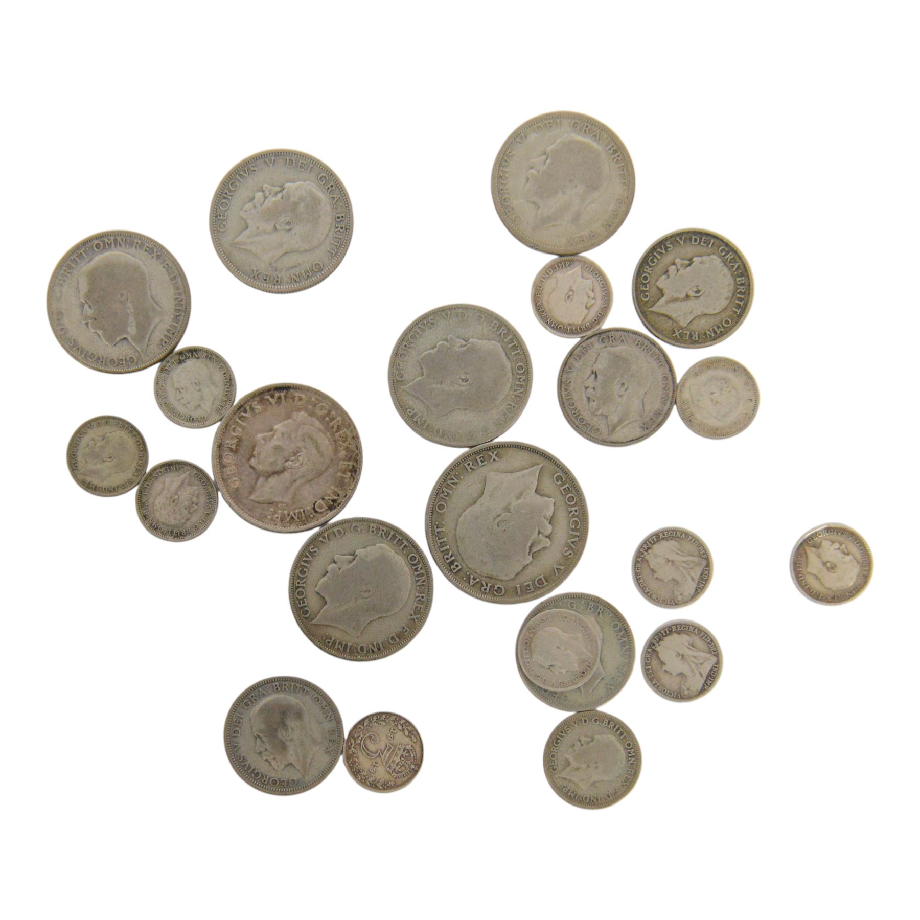 Approximately 107 grams of Great British pre-1947 silver coins, and a King George VI Canada 1943 silver fifty cent coin