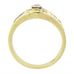 18ct gold diamond and ruby crossover ring, the principal round brilliant cut diamond of approx 0.10 carat, with graduating round brilliant cut diamond and calibre cut ruby shoulders, stamped 750