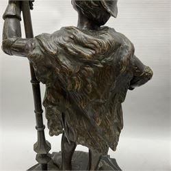 Pair of bronzed figure modelled as a hunter in traditional dress, each holding a pike, H48cm