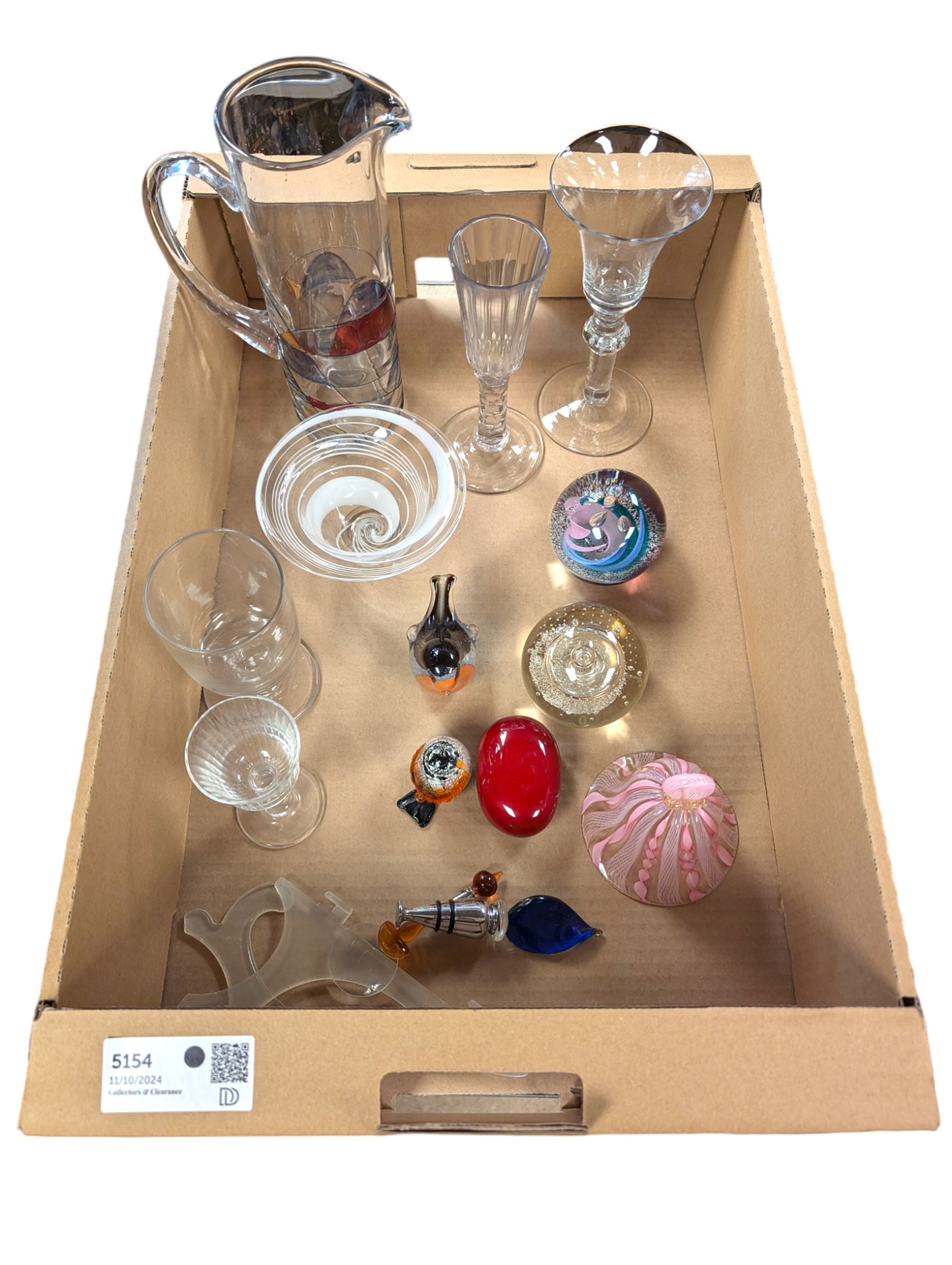 Collection of glassware, including two Caithness paperweights, Langham robin paperweight, Murano bell, etc