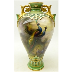  Hadley's Worcester vase, of baluster form with two pierced gilt handles, painted with a continuous landscape scene with pheasants in a tree, signed A. Shuck, H31cm  