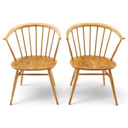 Ercol - pair of 'Cowhorn' elm carver chairs, curved back raised on nine stretchers, elm di...