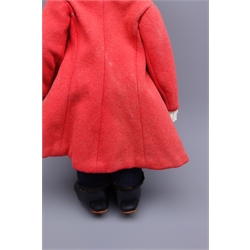  Lenci pressed-felt girl doll, brown painted side glancing eyes, brown bobbed mohair wig, jointed felt body, red felt buttoned coat with frill collar and cuffs, high waisted trousers, cotton shirt and black boots, printed Lenci marks to sole of feet, H44cm  