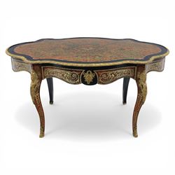 Late 19th century boulle work centre table, shaped serpentine top decorated with brass inlay on red tortoiseshell ground within ebonised border, fitted with single frieze drawer, on cabriole supports with gilt metal mounts and mask terminals