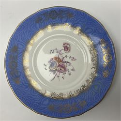 Set of three Victorian teacups and saucers, with matching dessert plate, decorated with a watered silk blue boarder and hand painted floral sprays to the centre 