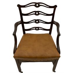 Georgian mahogany elbow chair, the shaped cresting rail over a series of pierced waved horizontal rails, shaped arms and carved supports, dished upholstered seat, moulded supports with later castors 