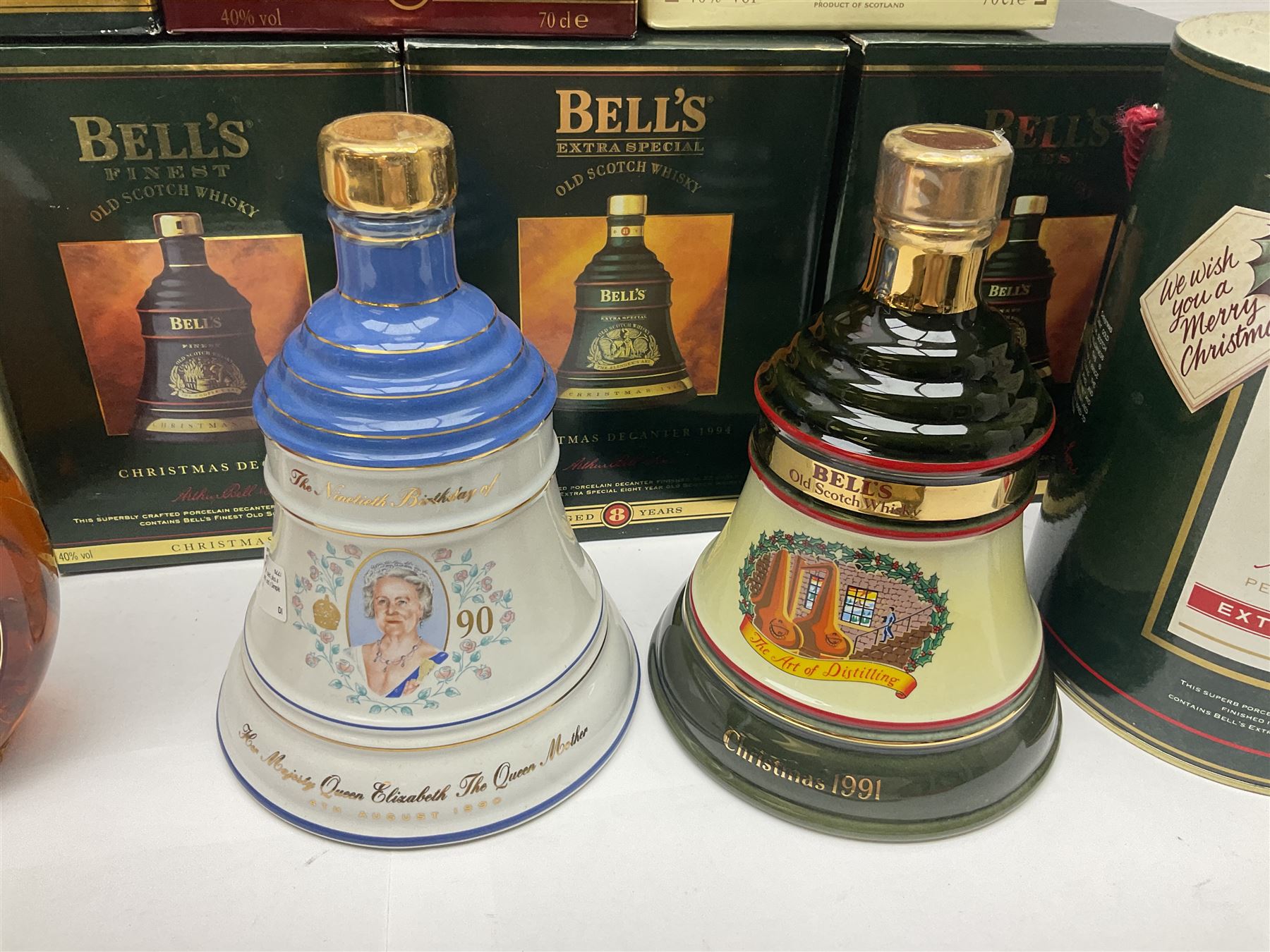 Dimple 15 Year Old Blended Scotch Whisky, together with nine Bells, scotch whisky, in Wade ceramic decanters, including Christmas 1991, 1998, 1996 etc, of various contents and proof 
