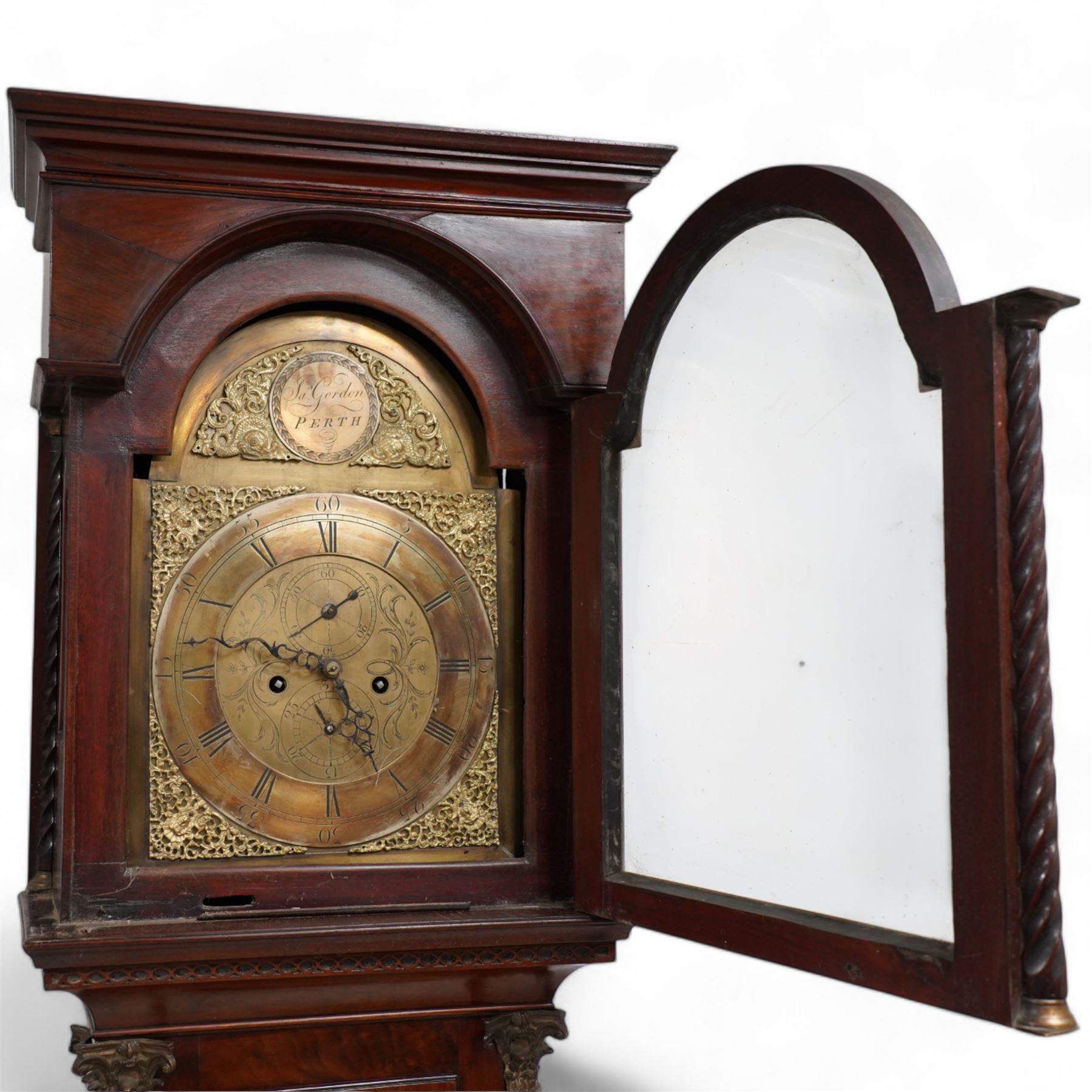 James Gordon of Perth -  8-day mahogany longcase c1790, in a mahogany case with a flat pediment hood and shallow cornice, break arch hood door beneath with matching spiral turned pilasters, trunk with full length conforming spiral pilasters and large brass Corinthian capitals, flat topped trunk door with  crossbanding, inlaid spandrels and an oval fan inlay to the centre, square plinth with matching inlay and a shaped base, brass dial with cast spandrels and circular boss with the makers name to the arch, engraved dial centre with seconds and calendar dials, chapter with Roman numerals, five minute Arabic's and steel hands, dial pinned to a rack striking movement sounding the hours on a bell. With weights and pendulum.  
James Gordon was a respected Scottish clock & watchmaker, granted the liberty to exercise his trade in Perth by the Incorporation of Hammermen on July 1st 1771. Died c1810.

This item has been registered for sale under Section 10 of the APHA Ivory Act

