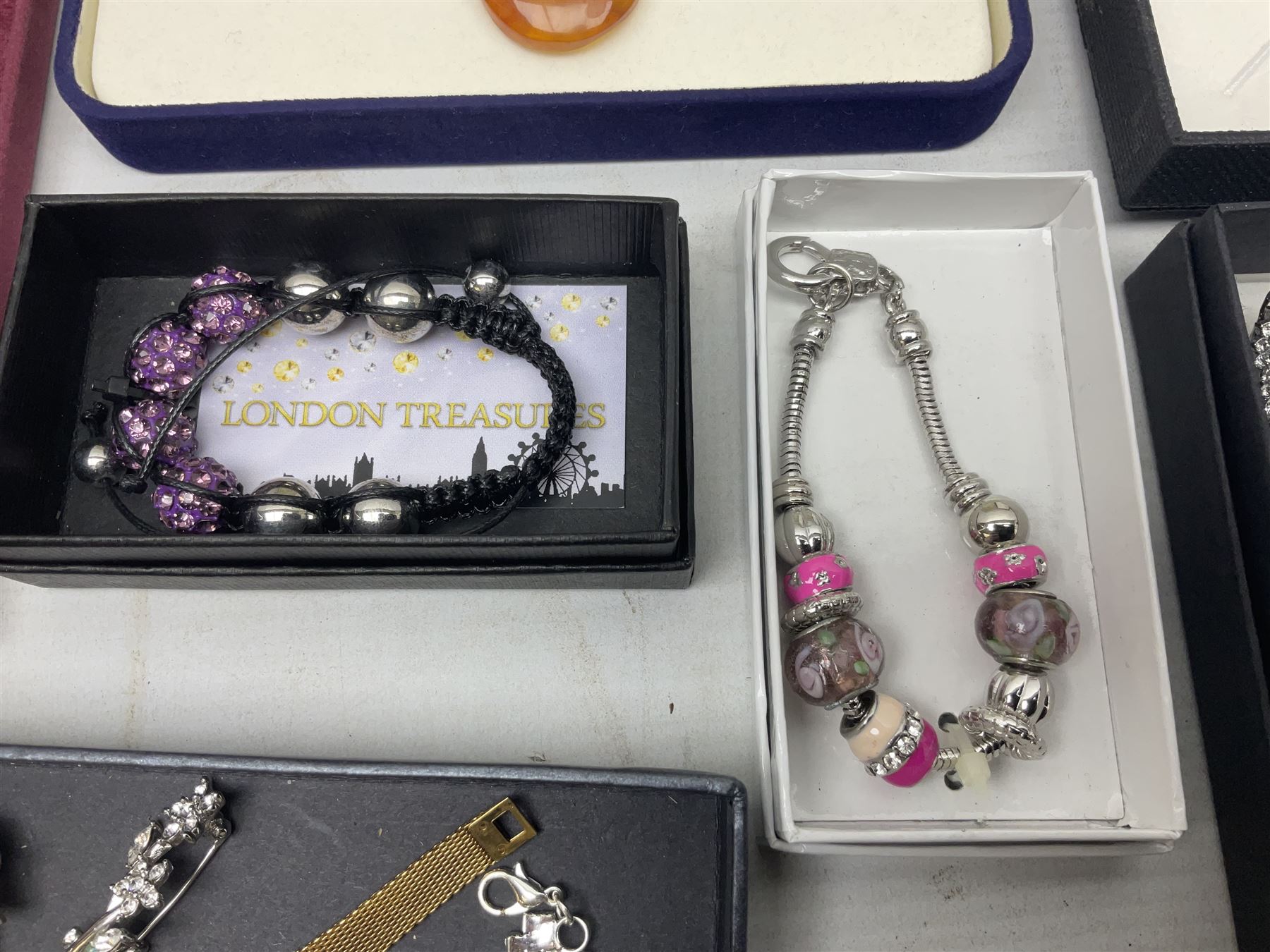 Silver-gilt drip design Lucy Q necklace, designed by Lucy Quartermaine, amber necklaces, silver-gilt stone set heart pendant, 10ct gold single stone set stud earrings, silver interchangeable pearl hoop earrings and a collection of costume jewellery and wristwatches 