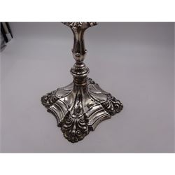 Modern silver five branch candelabra centrepiece, the four extending branches each with removable sconces, surrounding a central candle holder, upon a knopped stem and weighted stepped square foot, with anthemion to each corner, hallmarked Roberts & Belk, Sheffield 1984, H36cm 