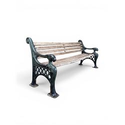 Neoclassical design cast iron and oak slatted garden bench, the twin end supports in the f...