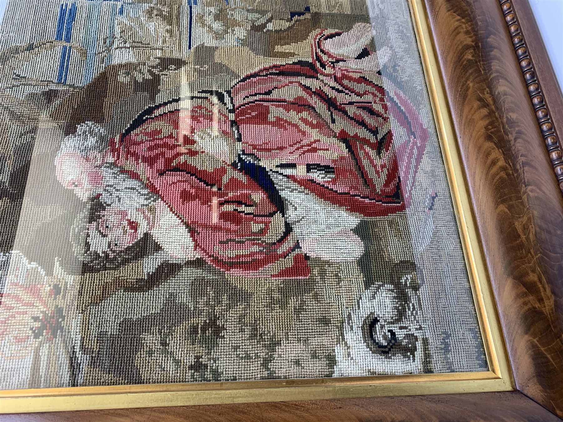 FRAMES - Victorian figured mahogany frame, with egg and dart edging and a gilt slip, containing a Berlin woolwork picture depicting Abraham and Isaac, H78cm W69.5cm