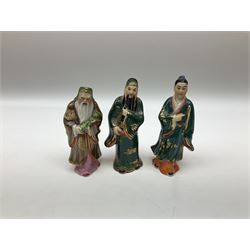 Japanese parquetry puzzle box L12cm; another Japanese puzzle box with marquetry top of Mount Fuji; eleven graduated Chinese figures including immortals; and Chinese figure of a lady standing on a hardwood base next to a horn table (14)