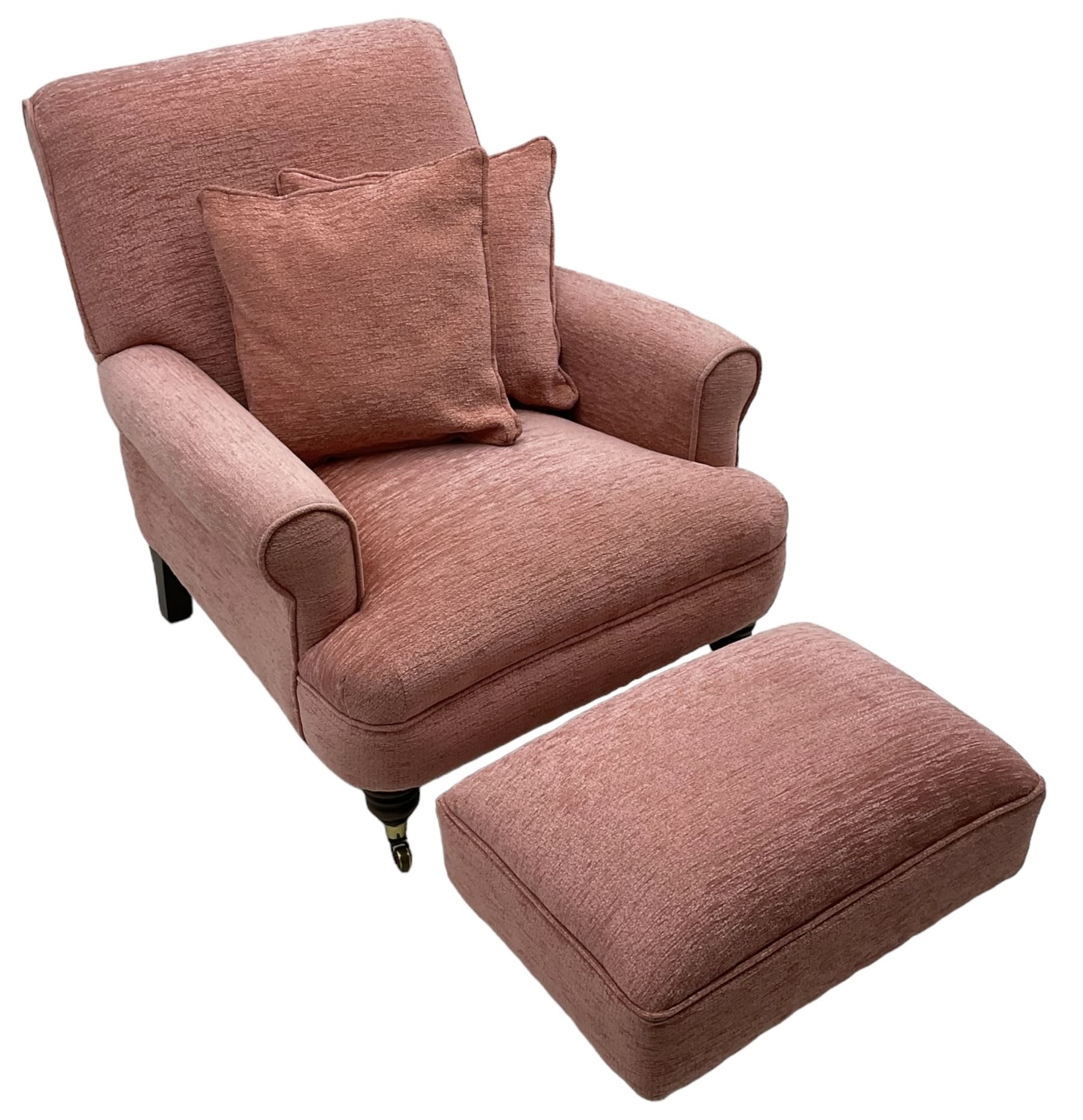 Victorian design armchair, rolled back and arms, upholstered in salmon pink fabric with two scatter cushions (W77cm, H82cm, D94cm); matching rectangular footstool (60cm x 41cm, H28cm)