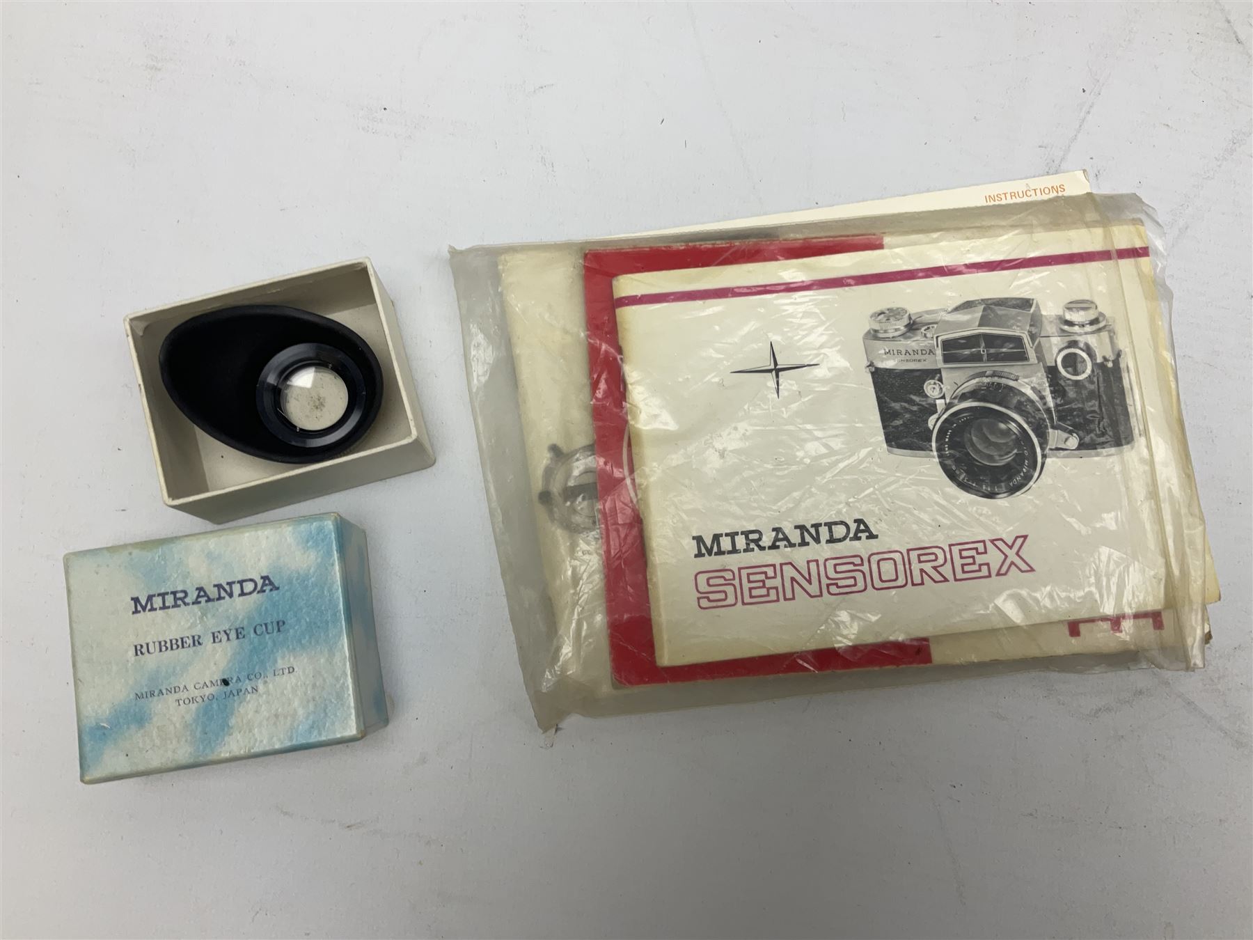 Miranda Sensorex camera body, Miranda Sensorex II camera body with 'Auto Miranda 1:1.8 f-59mm' lens, 'Auto Miranda 1:2.8 f-135mm' lens, 'Auto Miranda 1:3.5 f-200mm' lens, 'Auto Miranda 1:2.8 f-28mm' len, Agfa plate camera with 9cm x 12cm plates and other camera equipment including Miranda camera bag