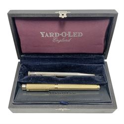 Hallmarked silver Yard-O-Led propelling pencil with engine turned decoration in original wooden box with paperwork and leather pocket sleeve; and a Sheaffer gold plated fountain pen with 14ct gold nib, box L17.5cm (2)