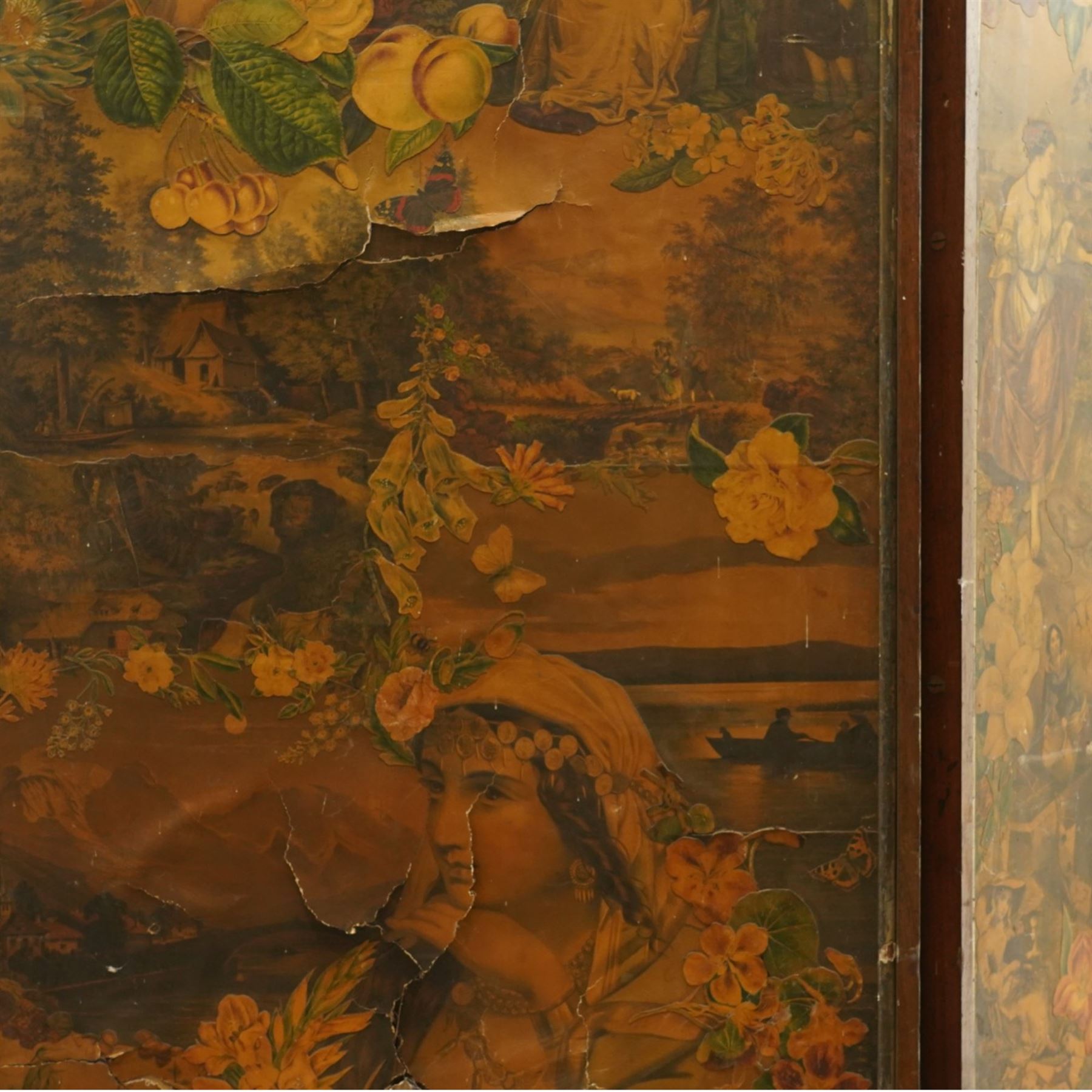 Victorian mahogany framed decoupage four-fold screen, the panels decorated with pastoral landscapes and figural scenes, within rounded moulded frames, fitted with brass mounts and amber glass handles