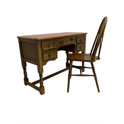 20th century oak kneehole desk with inset leather top, and wheel back chair