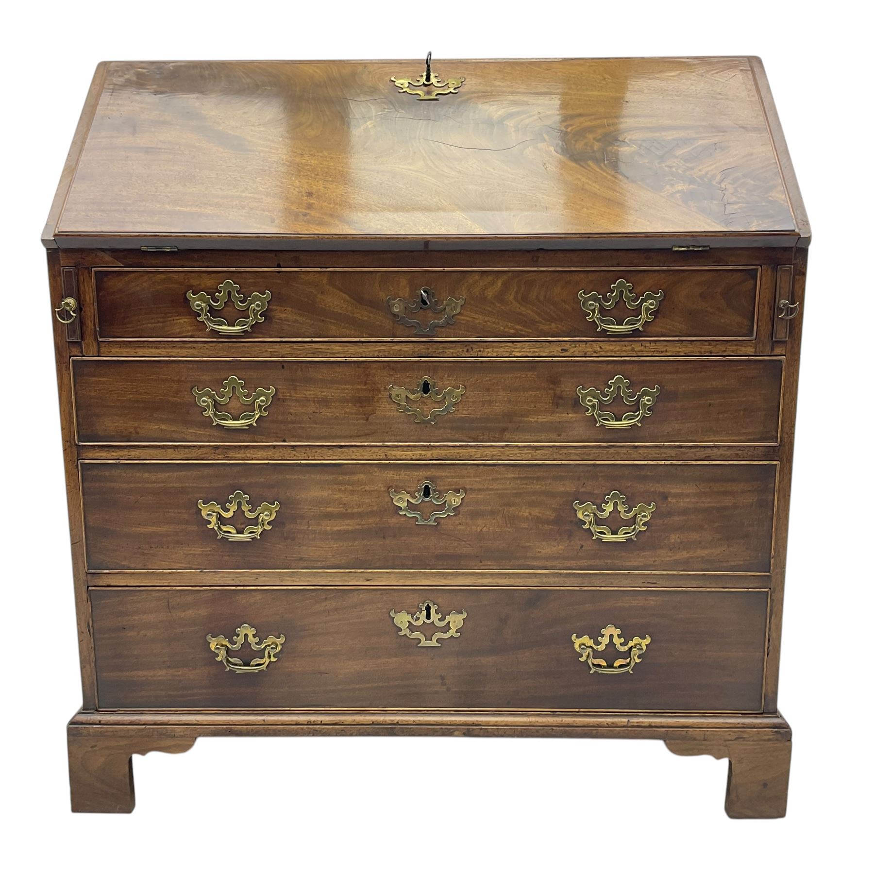 George III mahogany bureau, fall-front enclosing a fitted interior of drawers, pigeonholes and central mirrored cupboard, over four graduated cockbeaded drawers with brass batwing handles, raised on bracket feet