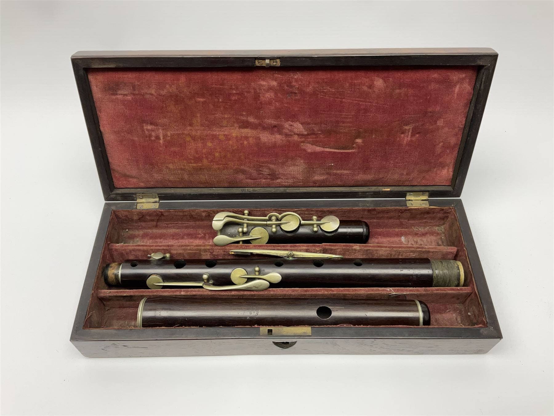 Victorian rosewood and nickel three-section flute by A. Buffet Paris, impressed 'S.R. Chappell 52 New Bond Street London 1851' L62cm; in fitted rosewood box