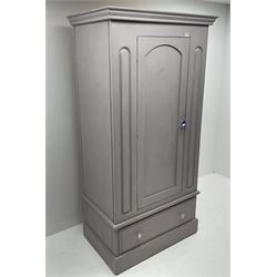 Painted pine single wardrobe, projecting cornice, single cupboard door, flanked by carved detailing, above single long drawer, plinth support
