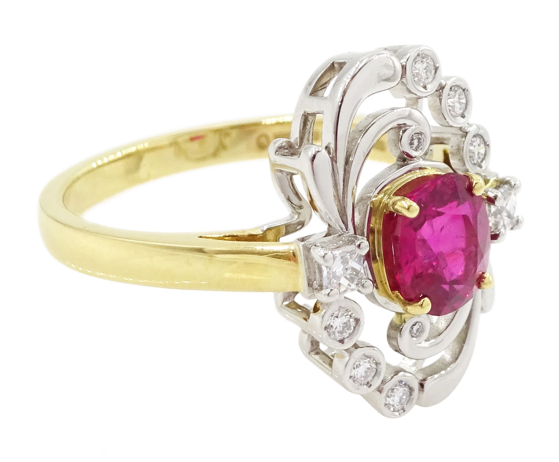 18ct gold and platinum Burmese ruby and diamond ring by Scarab London, single rectangular cushion cut unheated ruby of 1.13 carat, with a single French cut diamond set either side and round brilliant cut diamond surround, in a scrolling foliate design setting, with Alan Poultney Gems report, the ruby with The Gem & Pearl Laboratory report