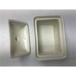 Emile Henry covered casserole dish of oval form in two tone brown and cream, no. 03.06, together with cast iron Nomar twin handled lidded casserole dish of oval form in navy, and other ovenware including Flintware ICTC, largest L35cm