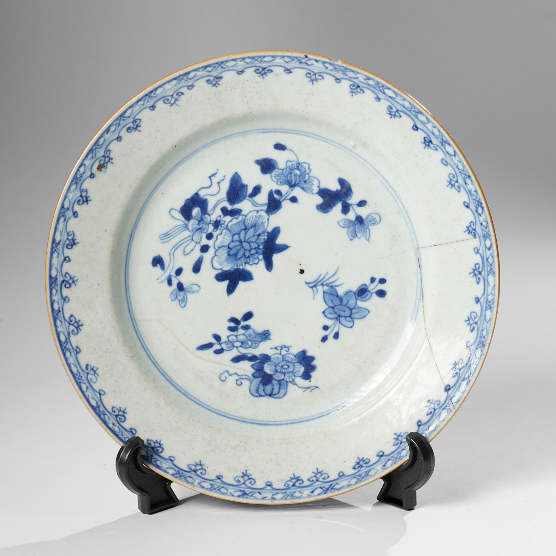 Three Chinese Kangxi period blue and white plates, painted in underglaze blue with various patterns, including Butterfly and Rockery, Pagoda and River Landscape, and floral sprays, each approx. D23cm (3)
