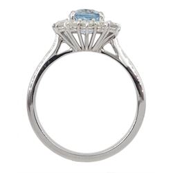 18ct white gold oval aquamarine and round brilliant cut diamond cluster ring, hallmarked, aquamarine approx 1.30 carat, total diamond weight approx 0.60 carat