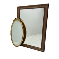 Victorian design gilt framed oval mirror, bow and garland pediment with roses, bevelled plate surrounded by ribbon-twist frame (76cm x 45cm); and large wall mirror (105cm x 75cm)